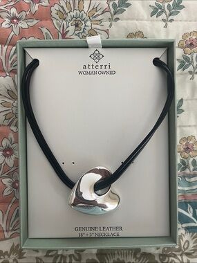 Genuine, leather and Silvertone heart necklace